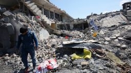 An Iraqi man inspects the damage in the Mosul al-Jadida area on March 26, 2017, following air strikes in which civilians have been reportedly killed during an ongoing offensive against the Islamic State group. Iraq is investigating air strikes in west Mosul that reportedly killed large numbers of civilians in recent days, a military spokesman said.