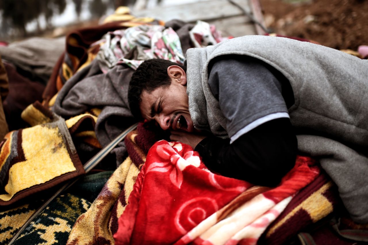 A man breaks down in tears while grieving for victims of a deadly airstrike in Mosul on March 17.