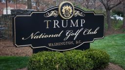 A sign for the Trump National Golf Club is pictured as President Donald Trump's motorcade arrives March 26, 2017 in Potomac Falls, VA.   