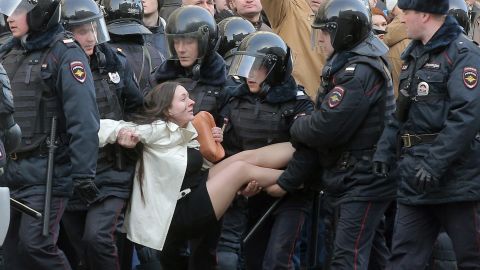 This image of Russian riot police detaining a demonstrator has been widely shared on social media.
