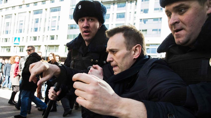TOPSHOT - This handout picture taken and provided by Evgeny Feldman for Alexei Navalny's campaign on March 26, 2017 shows police officers detaining Kremlin critic Alexei Navalny during an unauthorised anti-corruption rally in central Moscow. / AFP PHOTO / Evgeny Feldman for Alexei Navalny's campaign / HO / RESTRICTED TO EDITORIAL USE - MANDATORY CREDIT "AFP PHOTO / Evgeny Feldman for Alexei Navalny's campaign" - NO MARKETING NO ADVERTISING CAMPAIGNS - DISTRIBUTED AS A SERVICE TO CLIENTSHO/AFP/Getty Images