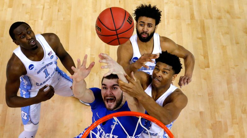 Kentucky Wildcats forward Isaac Humphries competes for a rebound against North Carolina during an NCAA Tournament game on Sunday, March 26. North Carolina went on to <a href="index.php?page=&url=http%3A%2F%2Fbleacherreport.com%2Farticles%2F2700142-unc-and-kentucky-go-back-and-forth-in-wild-finish" target="_blank" target="_blank">defeat Kentucky 75-73</a> and advance to the Final Four. 