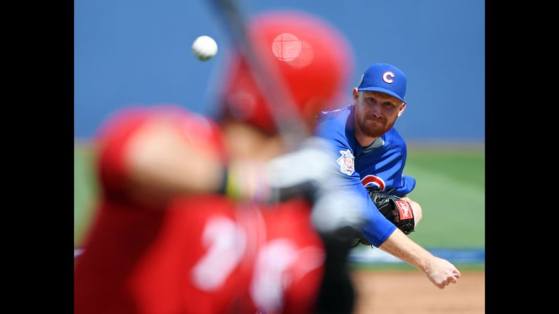 Eddie Butler of the Chicago Cubs pitches against Eugenio Suarez of the Cincinnati Reds during an exhibition game on Saturday, March 26, in Las Vegas. 