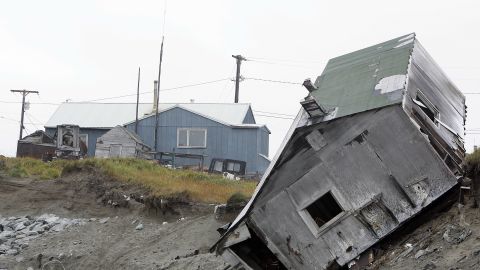 A house fell off the edge of the land in 2006. The Kokeok home is shown in the background.