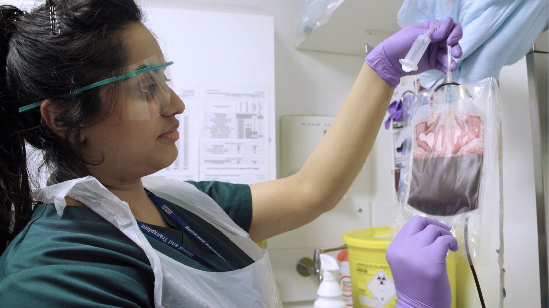 Blood extracted from an umbilical cord and placenta by a member of the Cord Bank Team at NHS Blood and Transplant.