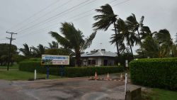 Palm trees blow in the wind in the town of Ayr in far north Queensland as Cyclone Debbie approaches on March 28, 2017.Lashing rain and howling winds battered northeast Australia as towns went into lockdown ahead of a "monster" cyclone making landfall, with thousands evacuated amid fears of damage and tidal surges. / AFP PHOTO / PETER PARKS        (Photo credit should read PETER PARKS/AFP/Getty Images)
