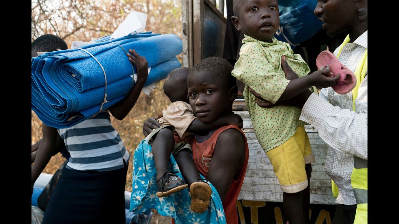 A South Sudanese boy carries as they arrive at Palorinya settlements where each family will be given a piece of land for shelter.