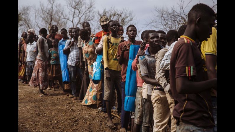 South Sudanese refugees queuing to be allocated plots at the recently established Imvepi settlement, Arua District, Northern Region, Uganda.