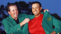 AUGUSTA, UNITED STATES:  US golfer Tiger Woods (R) is awarded his green jacket by 2004 champion Phil Mickelson of the US at the 2005 Masters Golf Tournament Championship 10 April 2005 at the Augusta National Golf Club in Augusta, Ga. Woods claimed his 4th Masters title by defeating fellow American Chris DiMarco in a one-hole playoff.     AFP PHOTO/Roberto SCHMIDT  (Photo credit should read ROBERTO SCHMIDT/AFP/Getty Images)