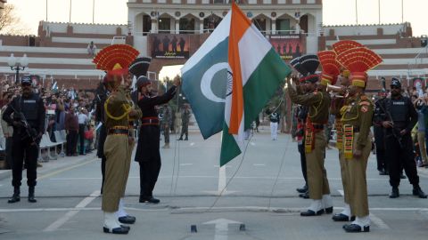 Indian and Pakistani border guards engage in a daily flag-lowering ceremony.
