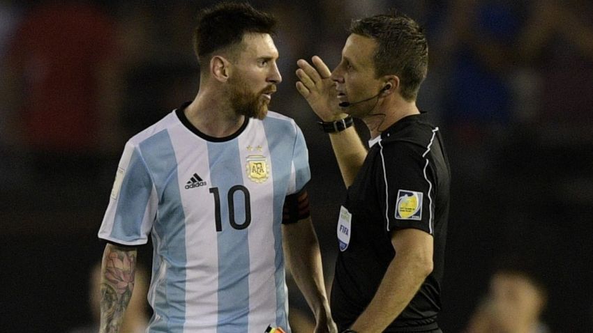 Argentina's Lionel Messi speaks with the linesman during their 2018 FIFA World Cup qualifier football match against Chile at the Monumental stadium in Buenos Aires, Argentina, on March 23, 2017. / AFP PHOTO / Juan Mabromata        (Photo credit should read JUAN MABROMATA/AFP/Getty Images)