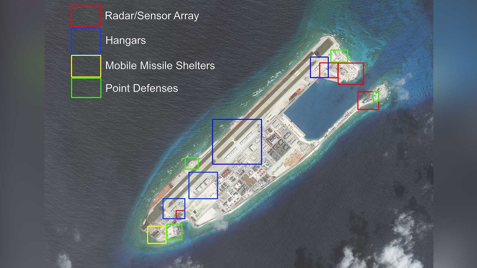 A satellite photo of China's artificial island on Fiery Cross Reef, taken on March 9, and highlighted by AMTI.