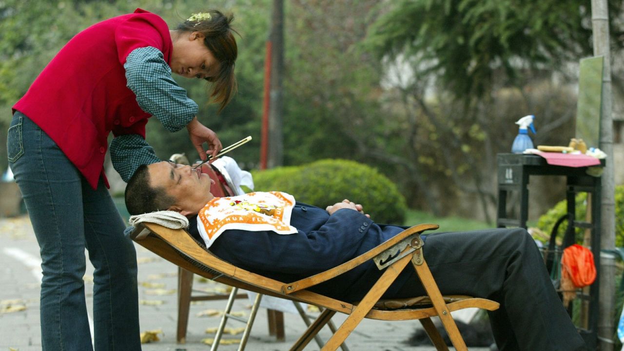 A quick shave in an outdoor setting.