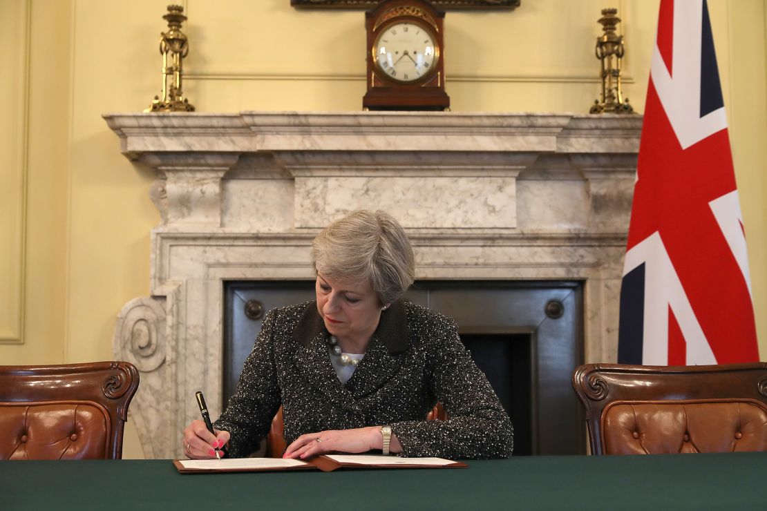 British Prime Minister Theresa May signs the official letter to European Council President Donald Tusk invoking Article 50.