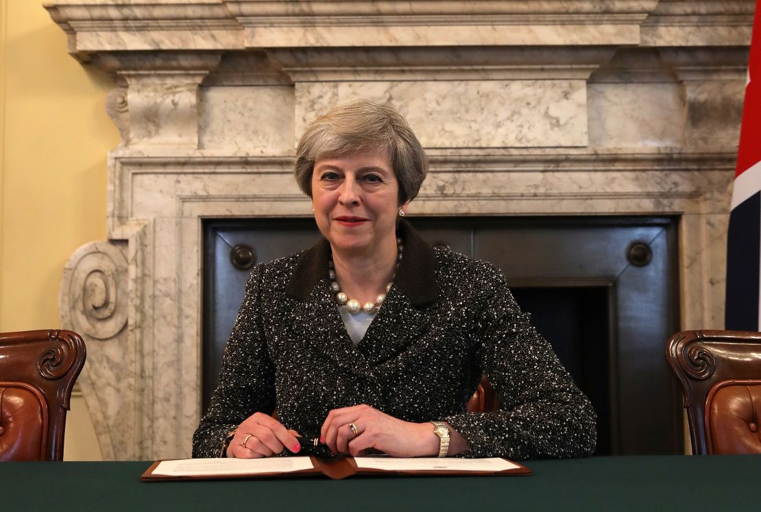 UK Prime Minister Theresa May signs the official letter triggering divorce papers from the EU in March.