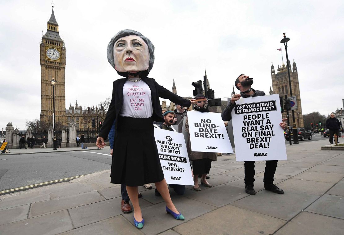 Protesters outside Parliament in London criticize Prime Minister Theresa May's Brexit approach on Wednesday. 
