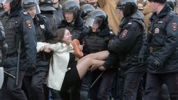 epa05871912 Russian riot policemen detain a demonstrator during an opposition rally in central Moscow, Russia, 26 March 2017. Russian opposition leader Alexei Navalny called on his supporters to join a demonstration in central Moscow despite a ban from Moscow authorities. Throughout Russia the opposition held the so-called anti-corruption rallies. According to reports, dozens of demonstrators have been detained across the country as they called for the resignation of Russian Prime Minister Dmitry Medvedev over corruption allegations.  EPA/MAXIM SHIPENKOV
