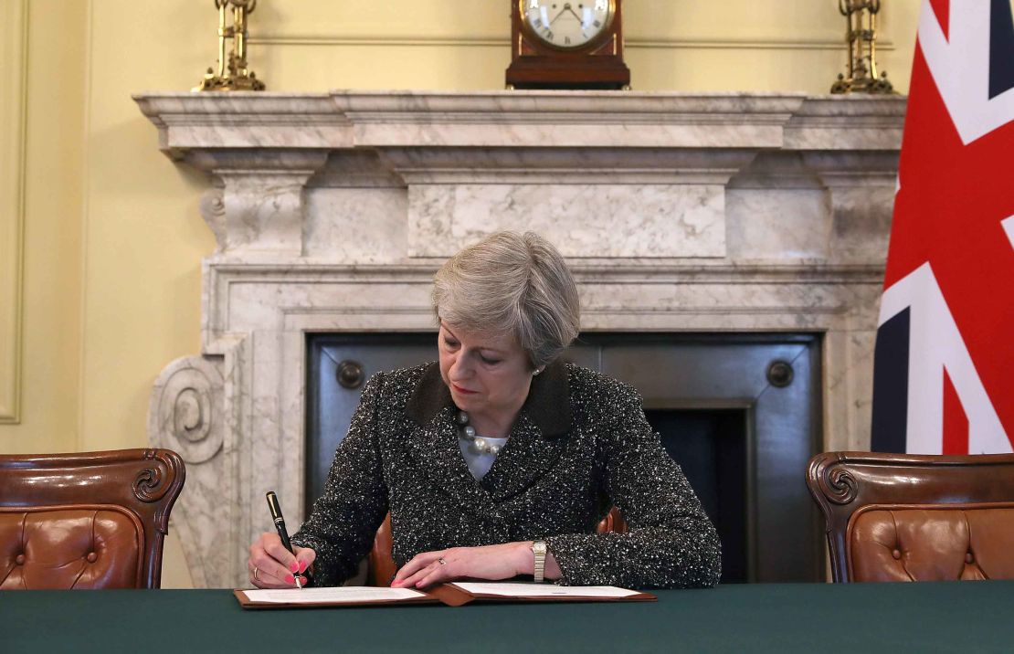 UK Prime Minister Theresa May signs the official letter invoking Article 50 on March 29.