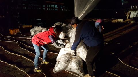 People pack balloons filled with content about the killing of Kim Jong Nam, the half-brother of North Korean leader Kim Jong Un, that they hope will float across the border into North Korea.