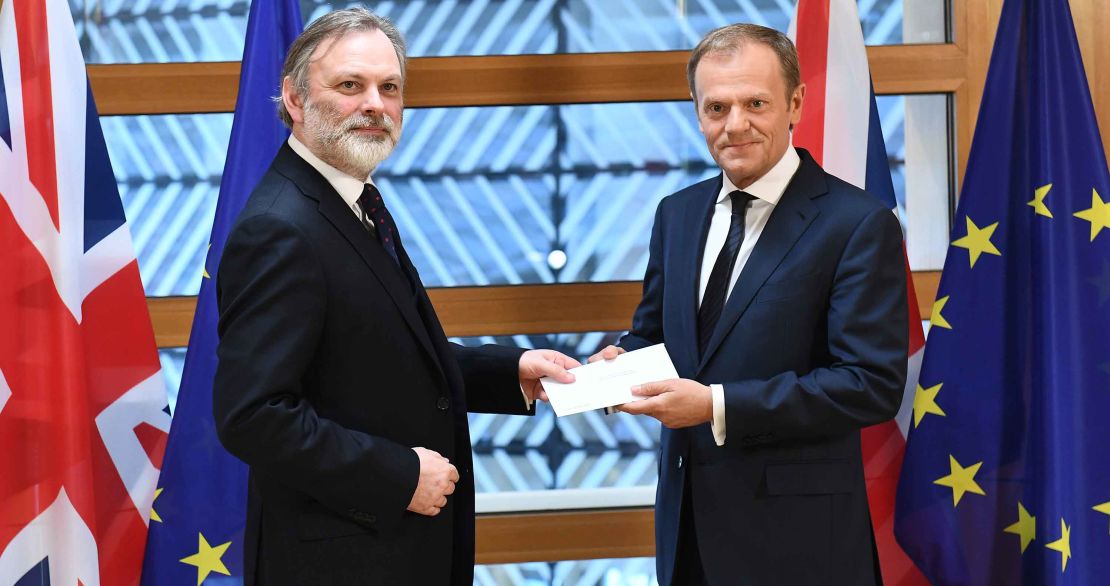 Britain's EU ambassador Tim Barrow delivers the Article 50 letter to European Council President Donald Tusk
