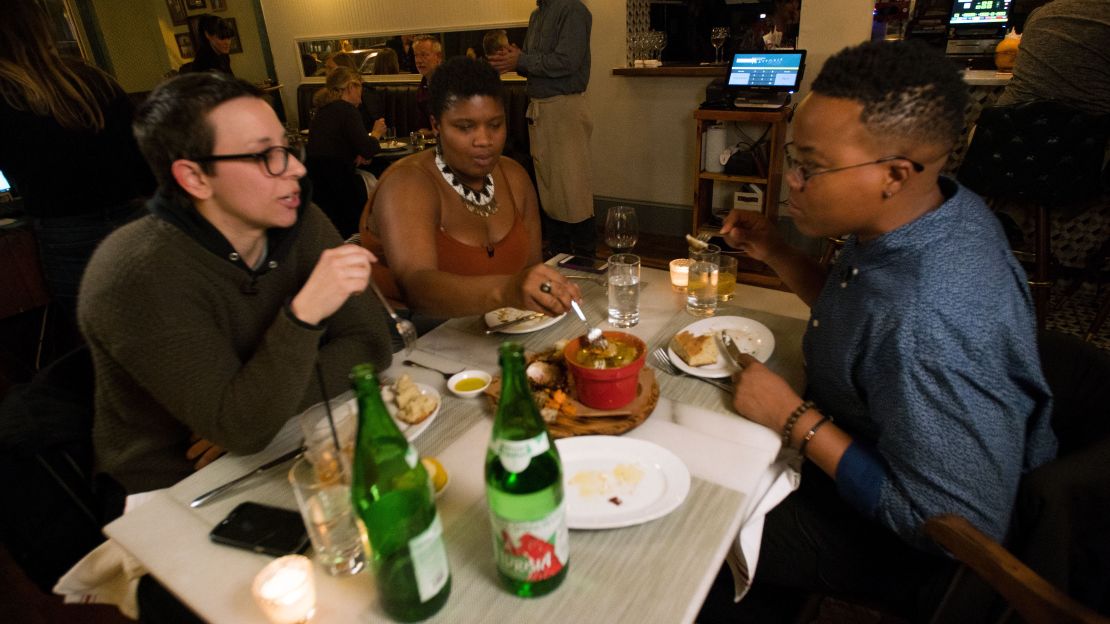 Bahar Karkouki (L), Stanley (C) and
Kori Higgs (R) gather to celebrate Higgs' birthday.