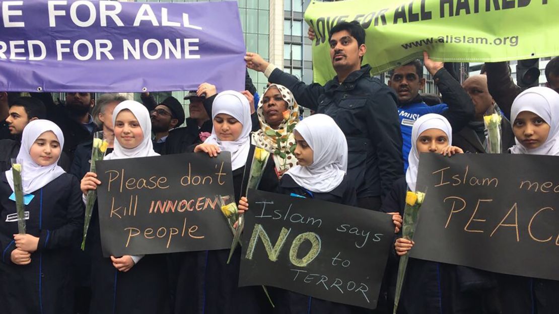 Community and faith groups carried banners with messages of solidarity. 