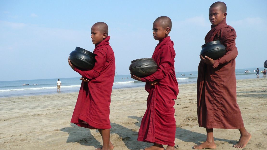 Buddhist novices collect morning alms in Chuang Tha, about 240 kilometers west of Yangon.