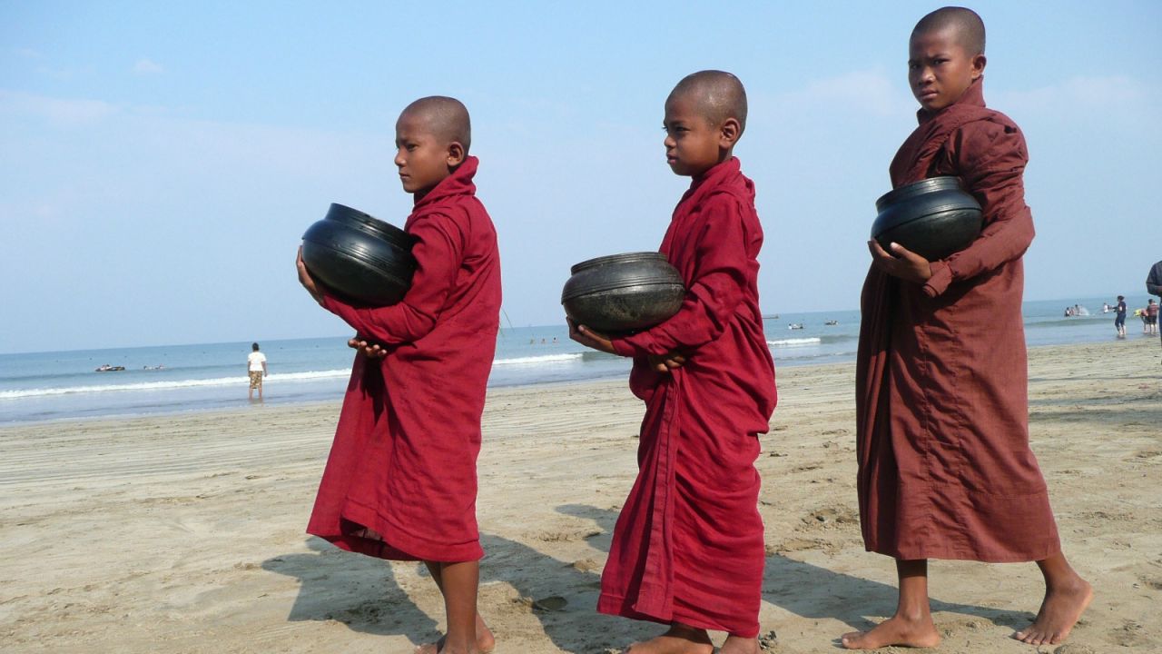 Buddhist novices collect morning alms in Chuang Tha, about 240 kilometers west of Yangon. 