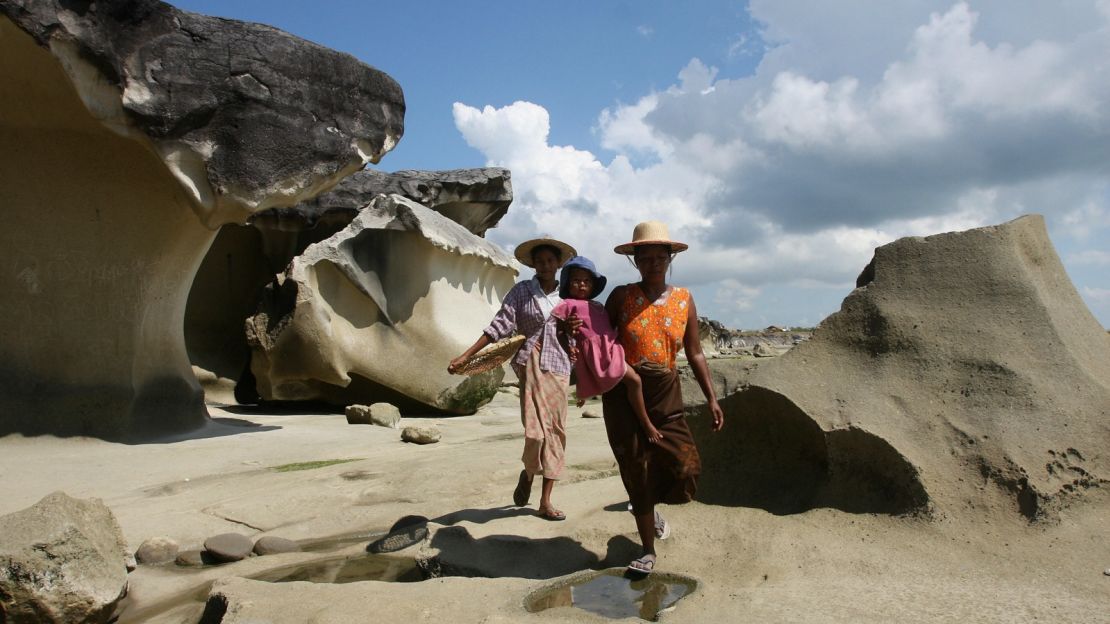 The standard Myanmar beach attire is jeans and a T-shirt -- on the sand and in the sea.