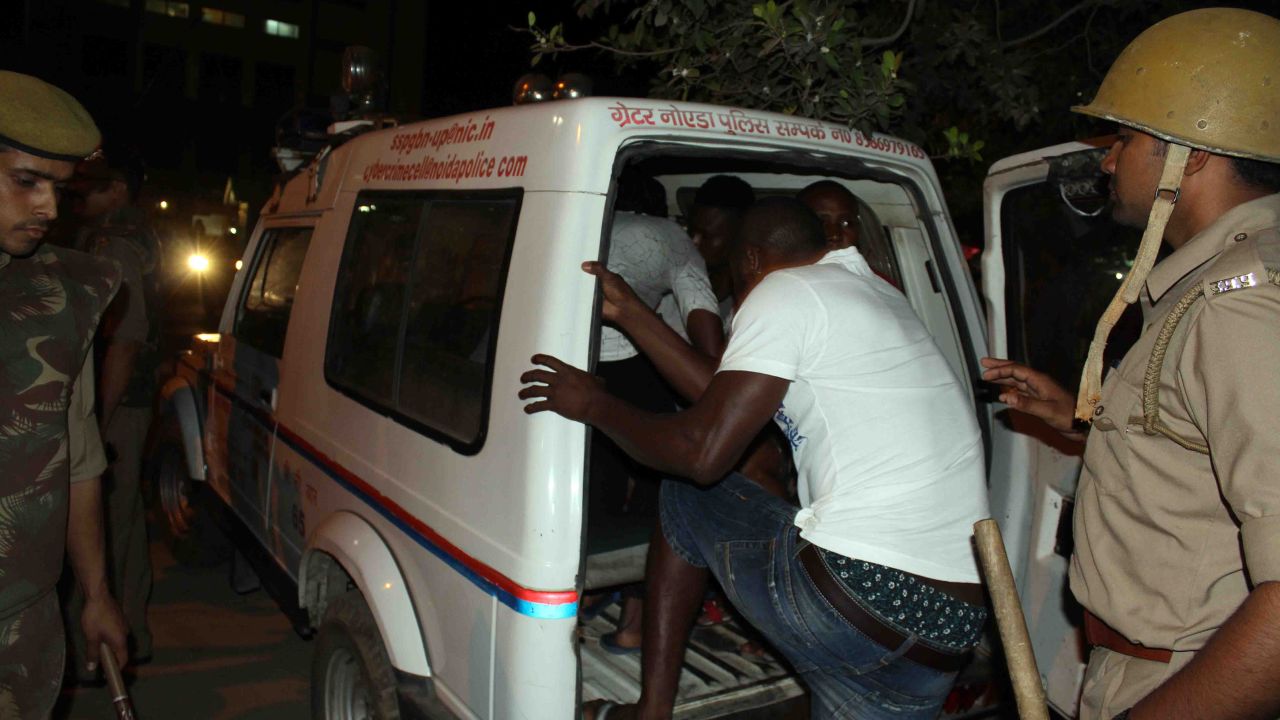 Indian police transport African nationals in Greater Noida, during a violent rampage by local residents.