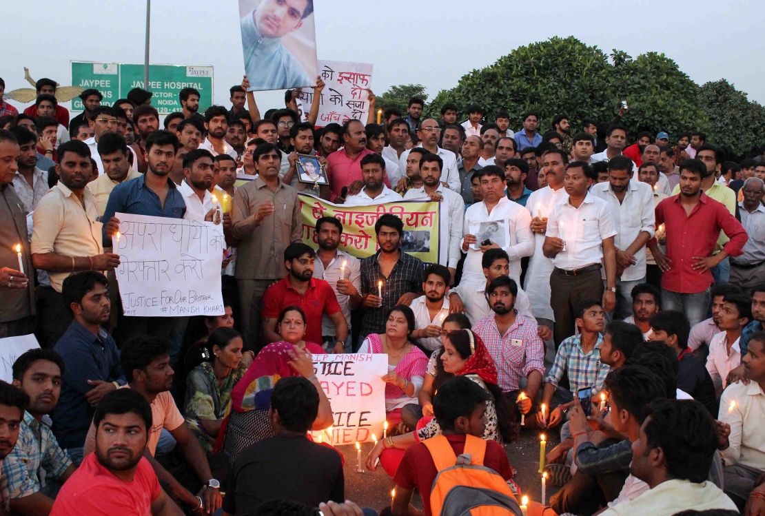 People gather for a vigil for a teenage boy who died of a suspected drug overdose in Greater Noida, which later turned into a violent rampage against African nationals.