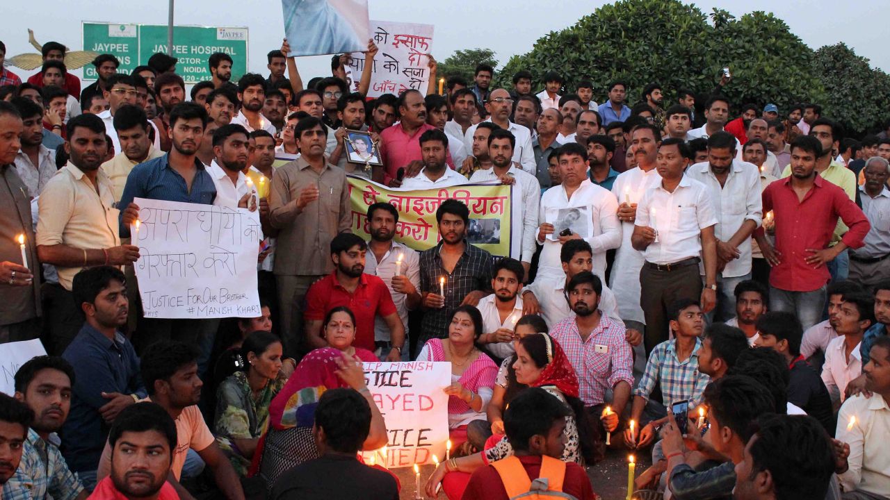 People gather for a vigil for a teenage boy who died of a suspected drug overdose in Greater Noida, which later turned into a violent rampage against African nationals.