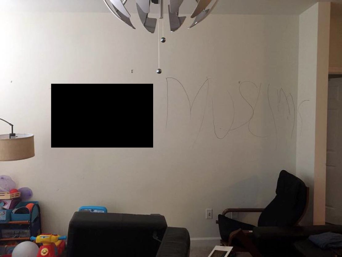 The Muslim family's home was vandalized, including anti-Muslim hate graffiti written on the wall.  CNN obscured the profanity written on the wall. 