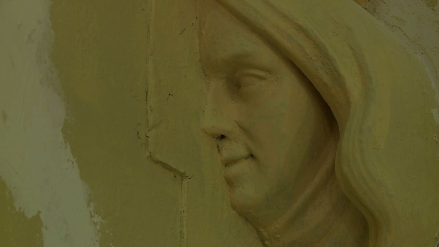 Mystery face uncovered behind church organ in Newport, Rhode Island.