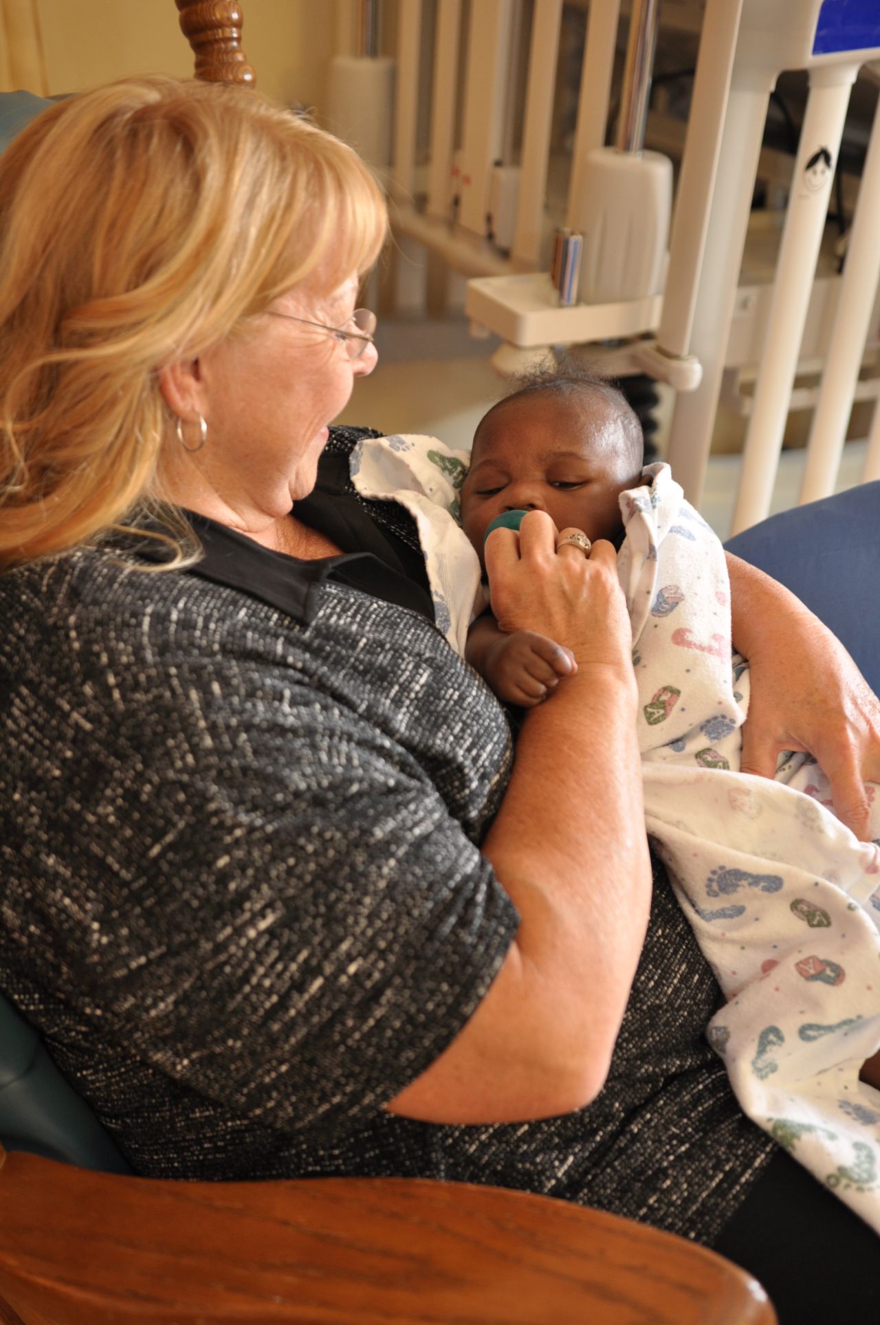 Carole Johnson comforts a baby at Madonna Rehabilitation Hospitals in Lincoln, Nebraska