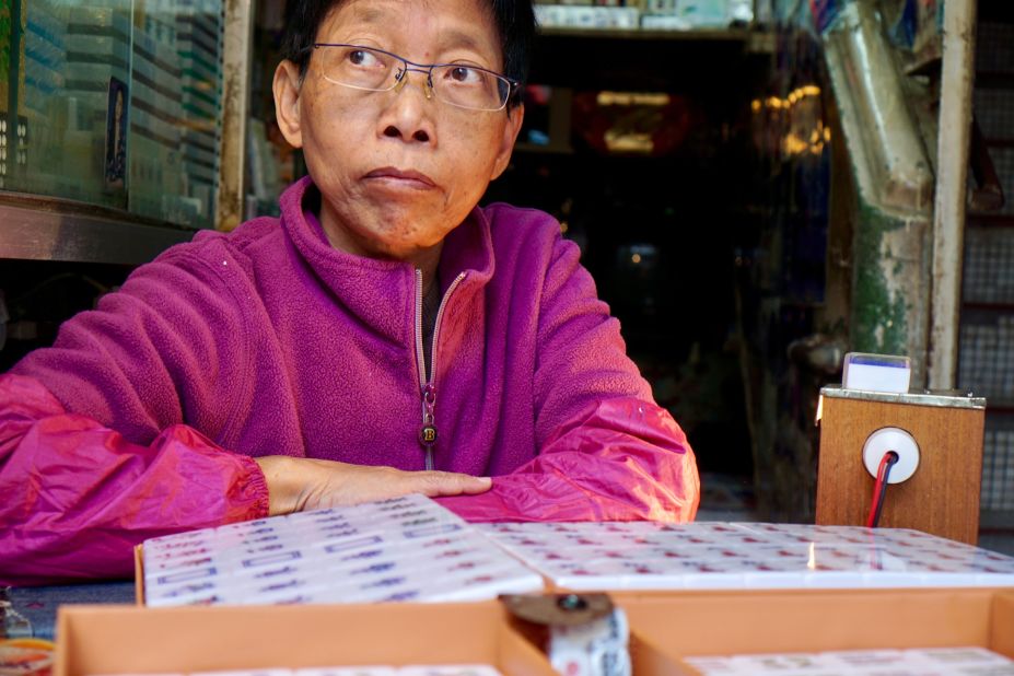 <strong>A dying industry:</strong> Ho, 59 years old, is one of Hong Kong's last mahjong tile carvers. She started carving when she was just 13 years old and now runs her family shop. 