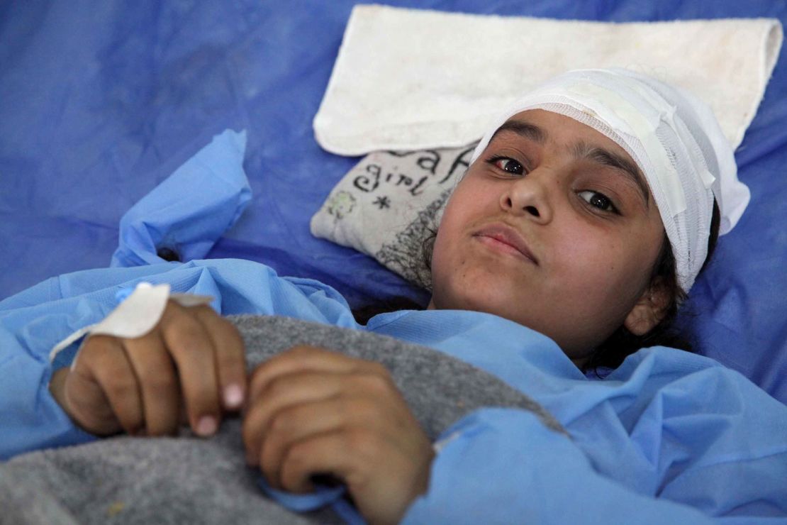 16-year-old Fatima lies in a bed at a the same Erbil hospital with a broken back. She was injured in an airstrike in the last two weeks though she doesn't recall specifically which. She only remembers being pulled out of the rubble afterwards.
