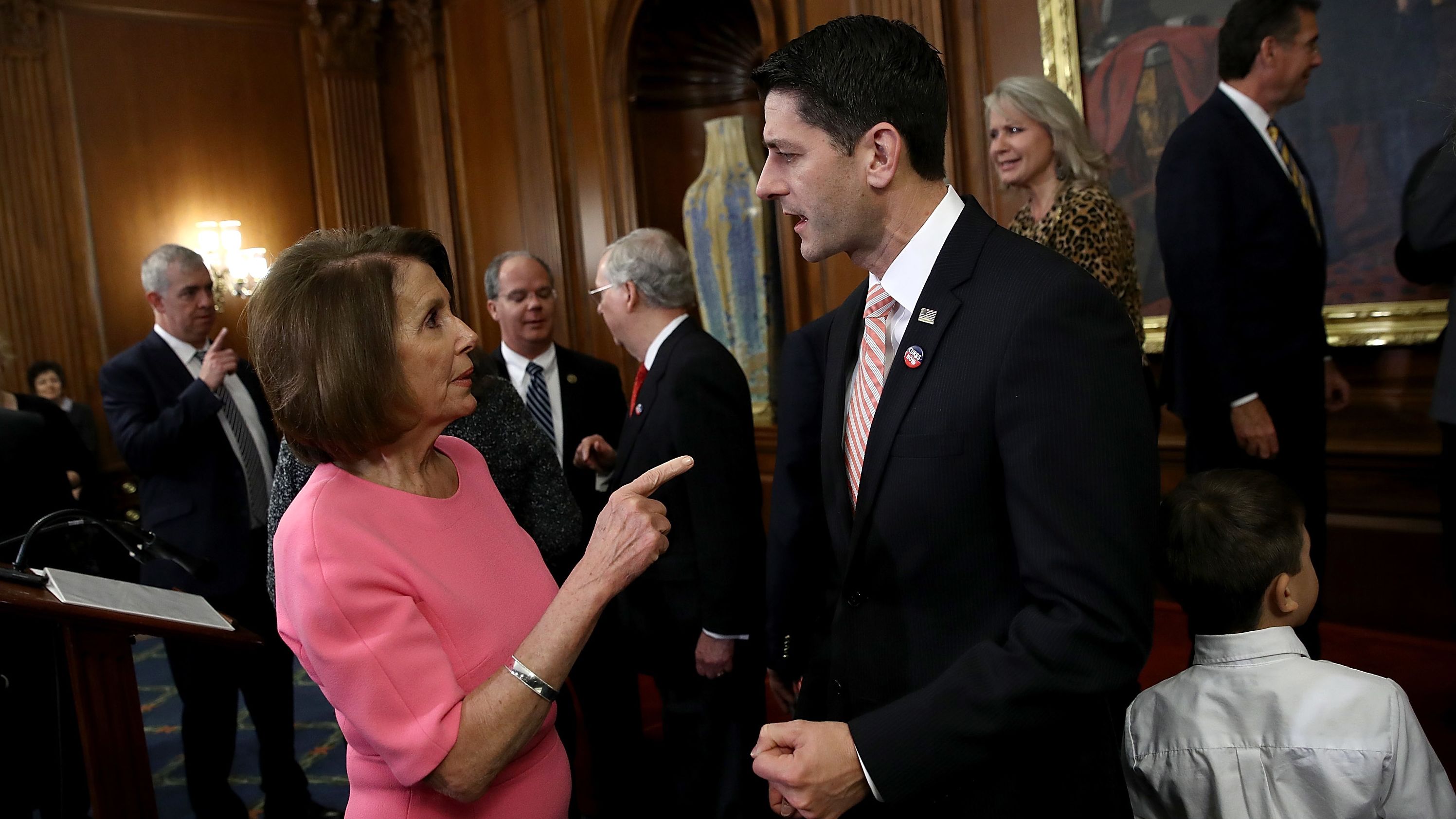 U.S. Speaker of the House Paul Ryan (R) (R-WI) speaks with House Minority Leader Rep. Nancy Pelosi (D-CA) following an event marking the passage of the 21st Century Cures Act at the U.S. Capitol December 8, 2016 in Washington, DC. 