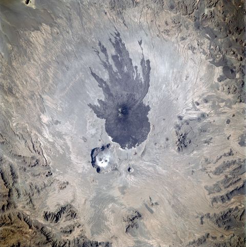 This image of the Tibesti Mountains, Chad, was taken in 1997. The squid-like shape the lava made as it flowed down the flanks of the Pic Tousside provided astronauts with a visual marker as they flew across northern Africa. 