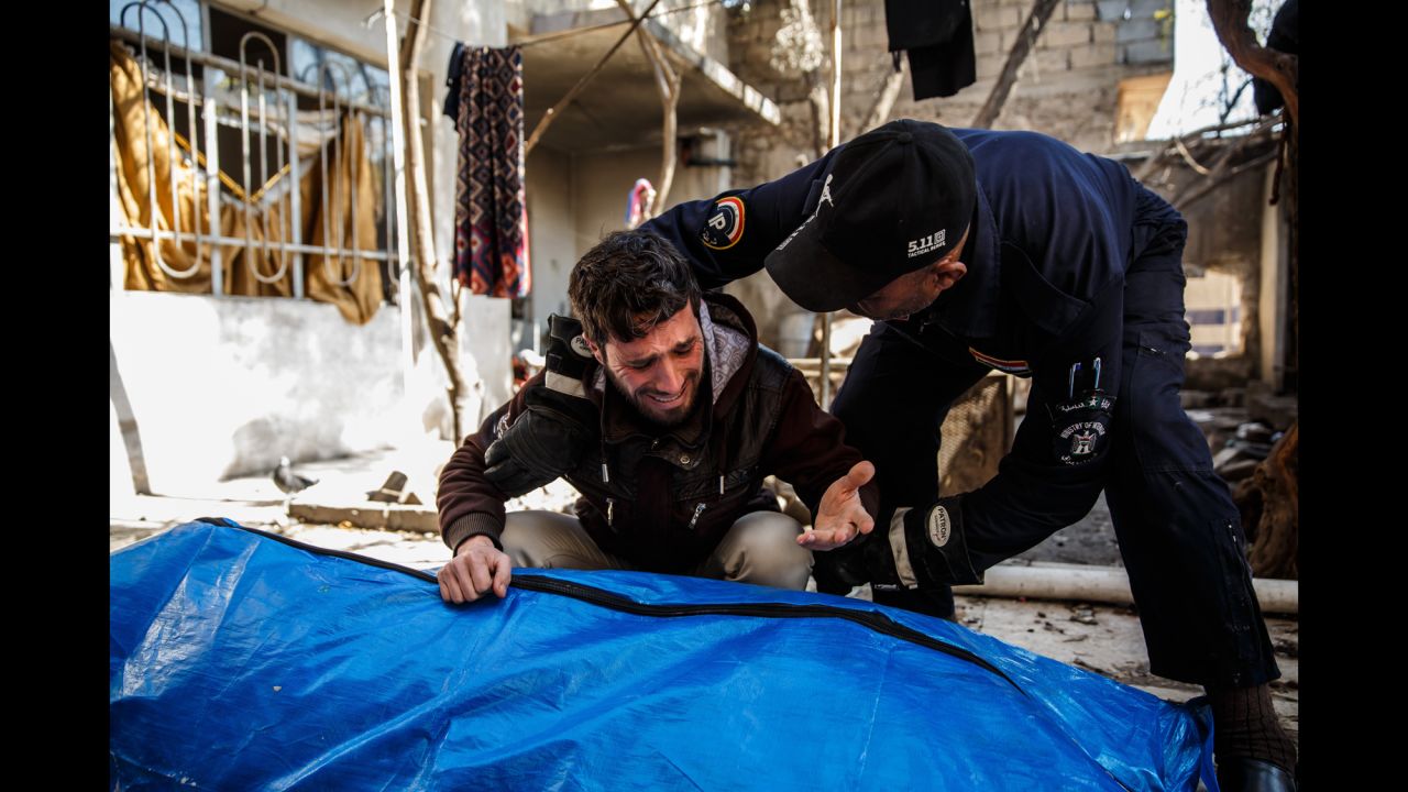 A man grieves for his loved ones after an airstrike in Mosul, Iraq, on Friday, March 24. <a href="http://www.cnn.com/2016/10/17/world/gallery/mosul/index.html" target="_blank">An offensive began in February</a> to reclaim western Mosul, ISIS' last major stronghold in Iraq, after Iraqi forces liberated the eastern half of the city.