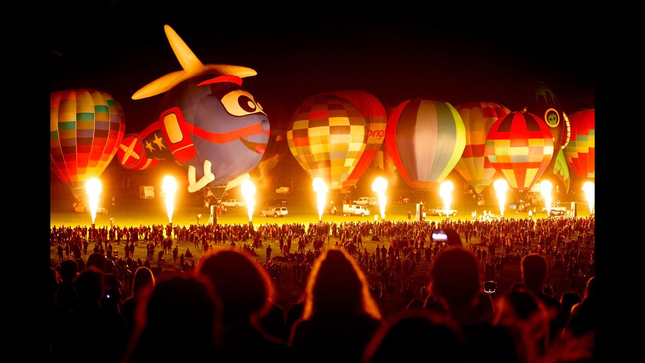 Hot-air balloons are inflated for the Zuru Night Glow event in Hamilton, New Zealand, on Saturday, March 25.