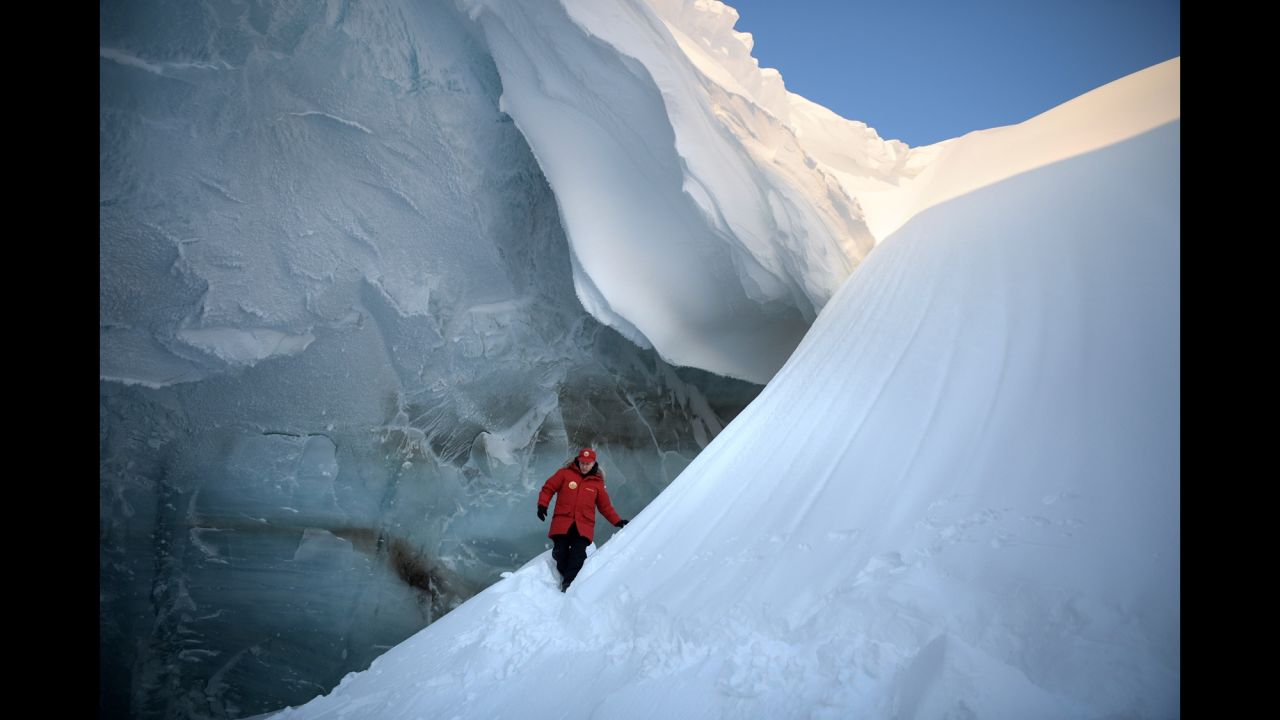 Russian President Vladimir Putin inspects a glacier crevasse on Franz Josef Land, a Russian archipelago in the Arctic, on Wednesday, March 29.