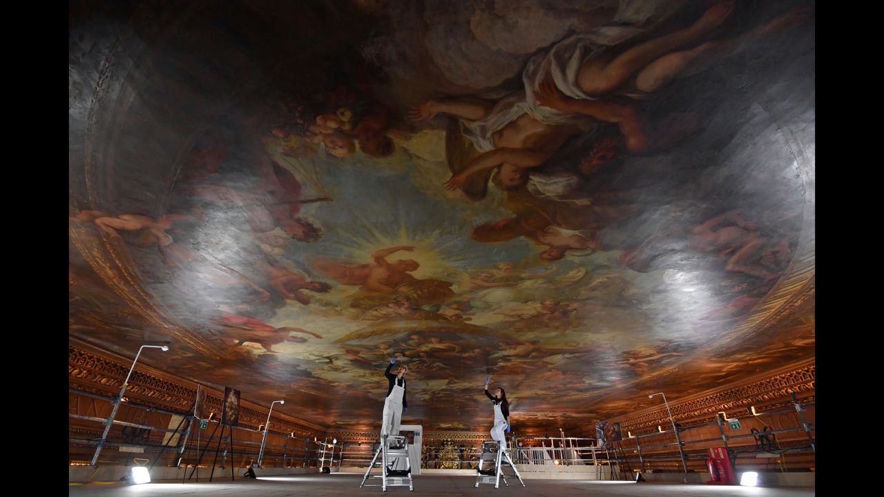 Conservators in London pose for a photo Thursday, March 30, as they promote the restoration project of the Painted Hall ceiling at the Old Royal Naval College. Over the next two years, conservators will work on the ceiling, which was painted between 1707 and 1726 by artist James Thornhill.
