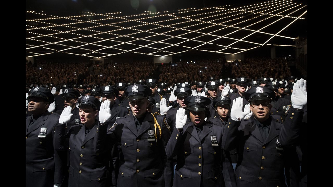 The newest members of the New York City Police Department are sworn in at their graduation ceremony on Thursday, March 30.