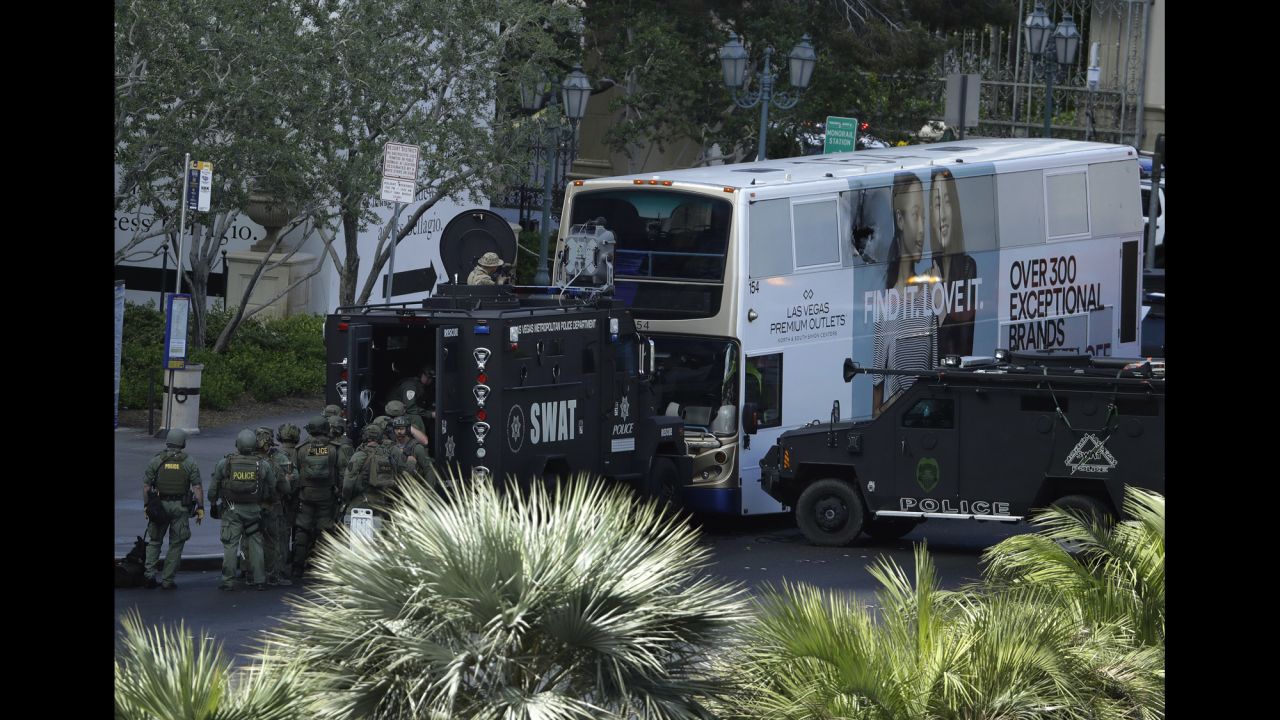 A SWAT team surrounds a bus along Las Vegas Boulevard on Saturday, March 25. Authorities say a man shot two people, killing one, on the bus. <a href="http://www.cnn.com/2017/03/25/us/las-vegas-shooting/" target="_blank">He surrendered to police</a> after a standoff that lasted more than four hours, police spokesman Larry Hadfield told reporters.