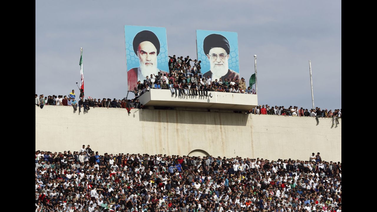 Soccer fans in Tehran, Iran, wait for the World Cup qualifier between Iran and China on Tuesday, March 28.