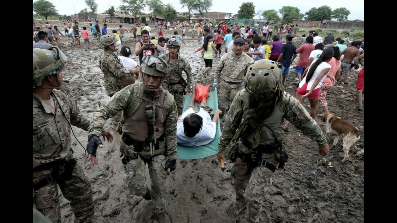 Soldiers help with evacuations in Piura, Peru, on Wednesday, March 29. More than half a million people in and around the country's capital of Lima <a href="http://www.cnn.com/2017/03/20/americas/peru-floods-mudslide-toll/" target="_blank">have been affected by storms and flooding,</a> authorities said last week. Weeks of rain have caused rivers across the country to rise.