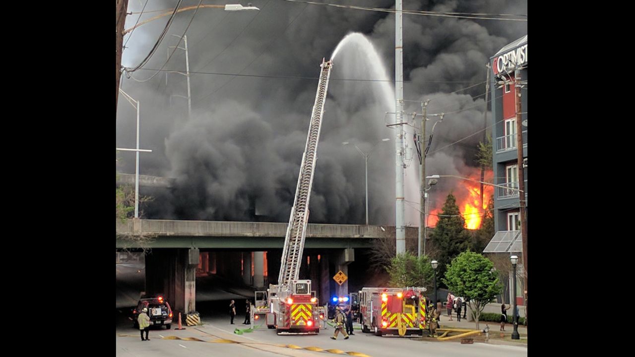 Firefighters battle the fire that eventually led to the collapse of part of I-85 in northeast Atlanta.