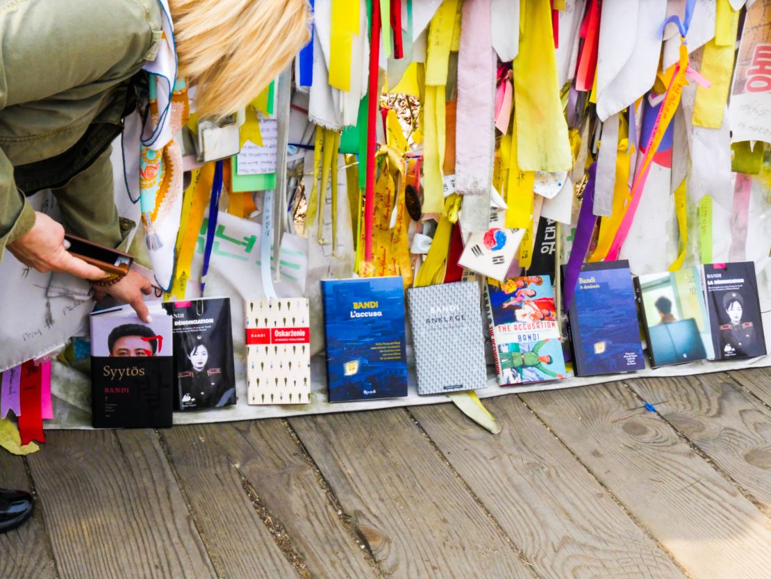 Copies of "The Accusation" translated into different languages are placed next to each other Thursday on the Bridge of Freedom at Imjingak in Paju.