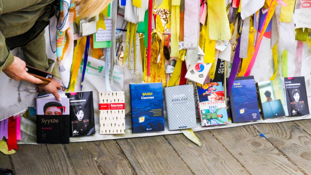 Copies of "The Accusation" translated into different languages are placed next to each other Thursday on the Bridge of Freedom at Imjingak in Paju.